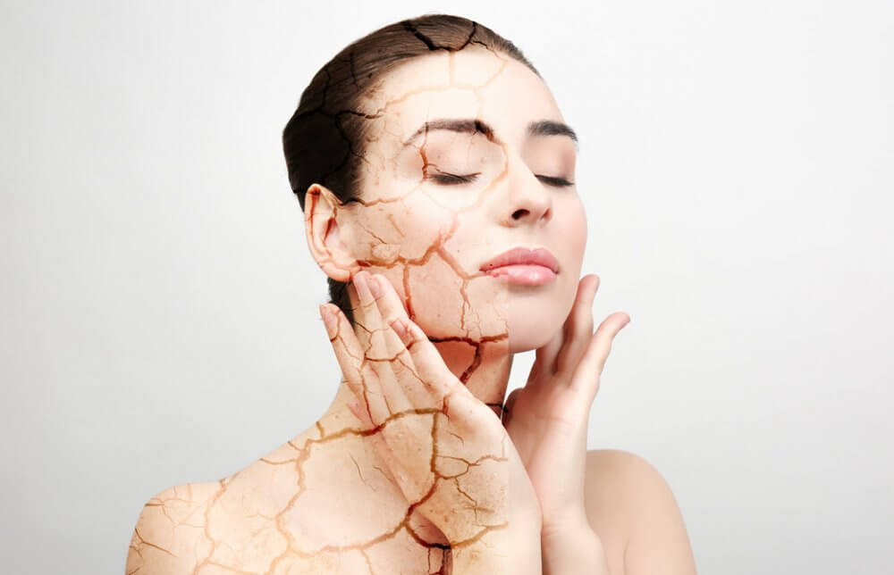 肌が砂漠のように乾燥してひび割れている女性のイメージ画像
