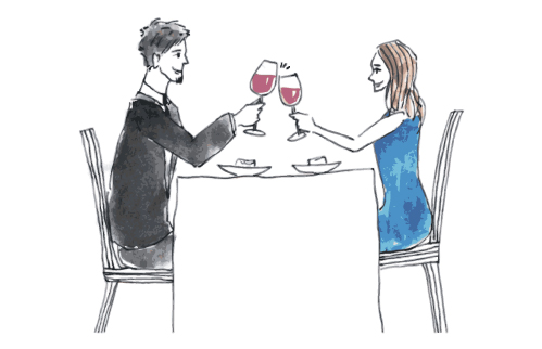 恋人たちが楽しそうにワインを飲む様子