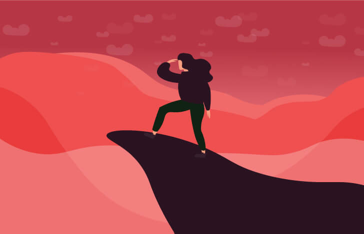 崖の先に立つ女性