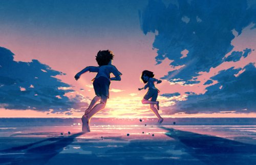 海辺を走る2人の子供